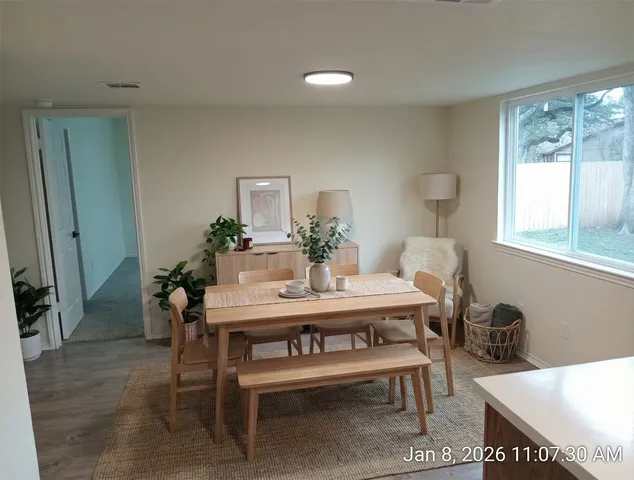 a view of a dining room with furniture