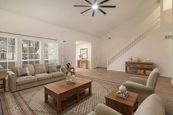 a living room with furniture and a large window