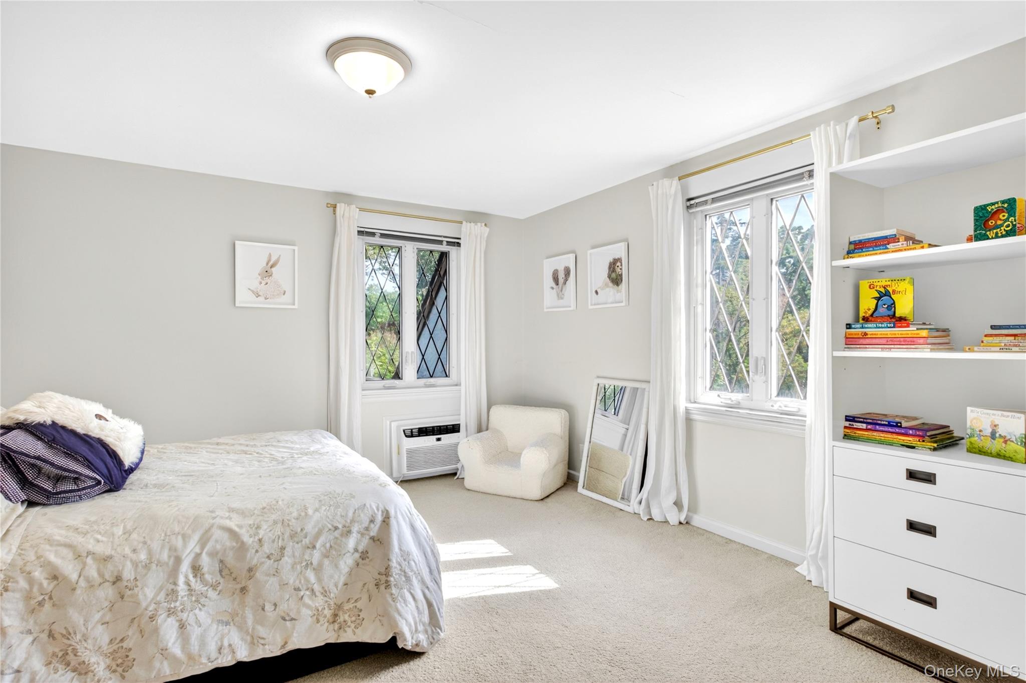 142 Mill Spring Road Manhasset, NY 11030 - Photo 15 of 23 a bedroom with a bed and a window