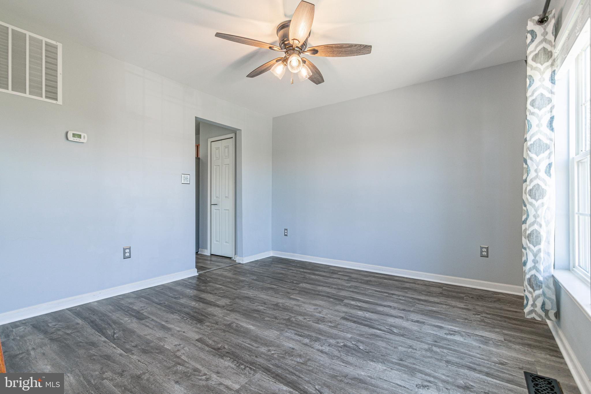 271 Courtney Court Spring Grove, PA 17362 - Photo 12 of 51 wooden floor in an empty room with a window