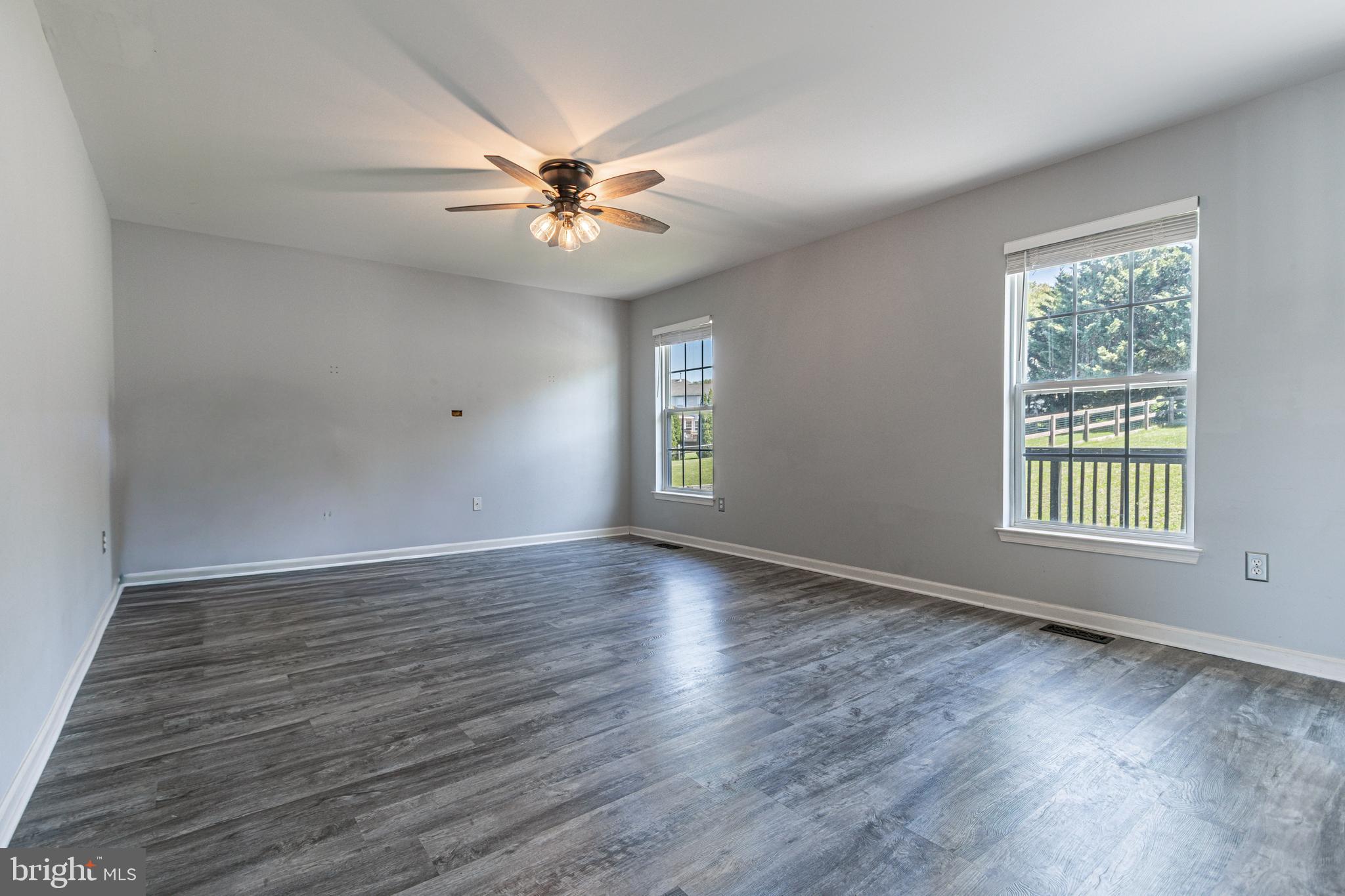271 Courtney Court Spring Grove, PA 17362 - Photo 15 of 51 a view of an empty room with wooden floor and a window