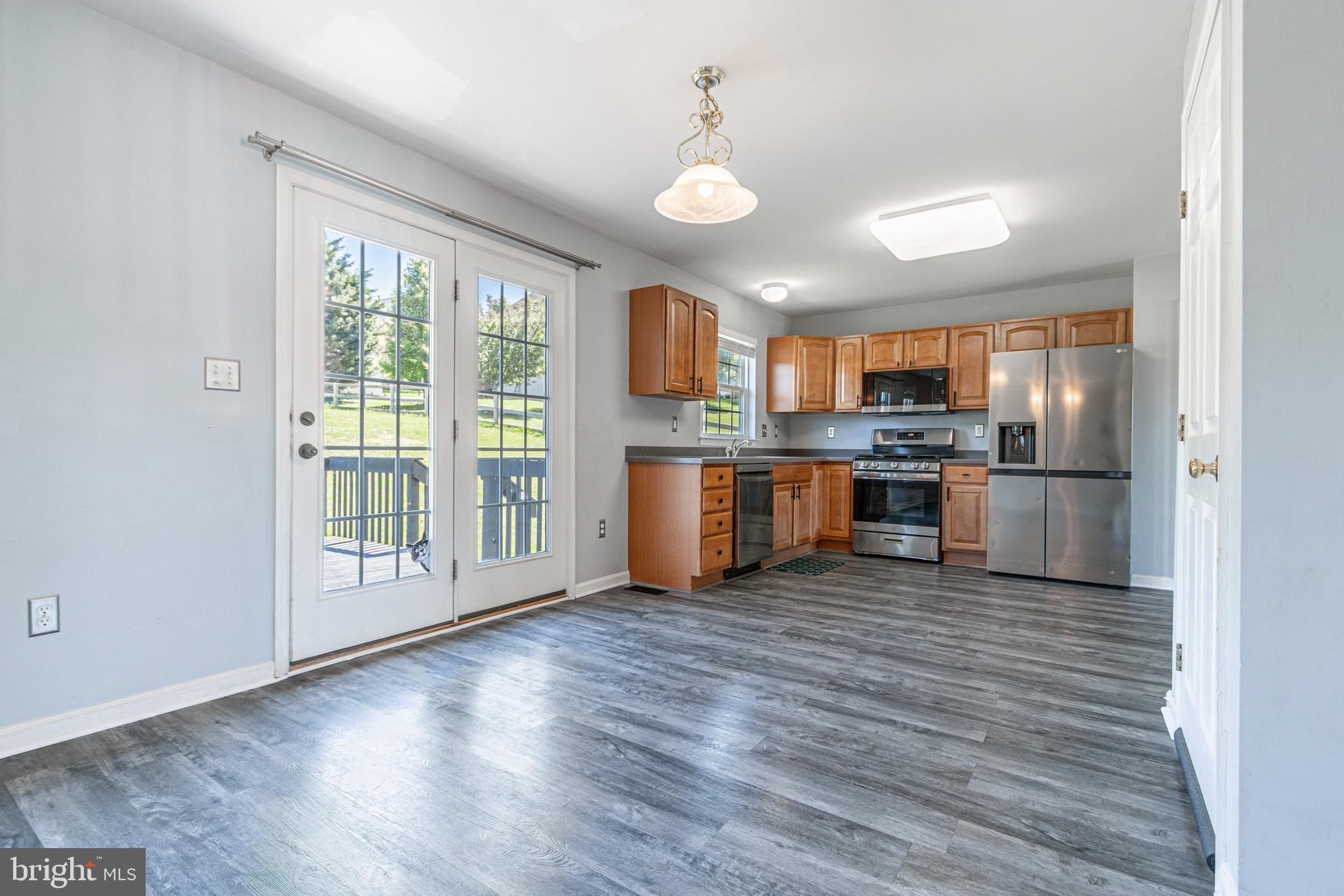 271 Courtney Court Spring Grove, PA 17362 - Photo 21 of 51 a view of a kitchen with a stove wooden cabinets and wooden floor