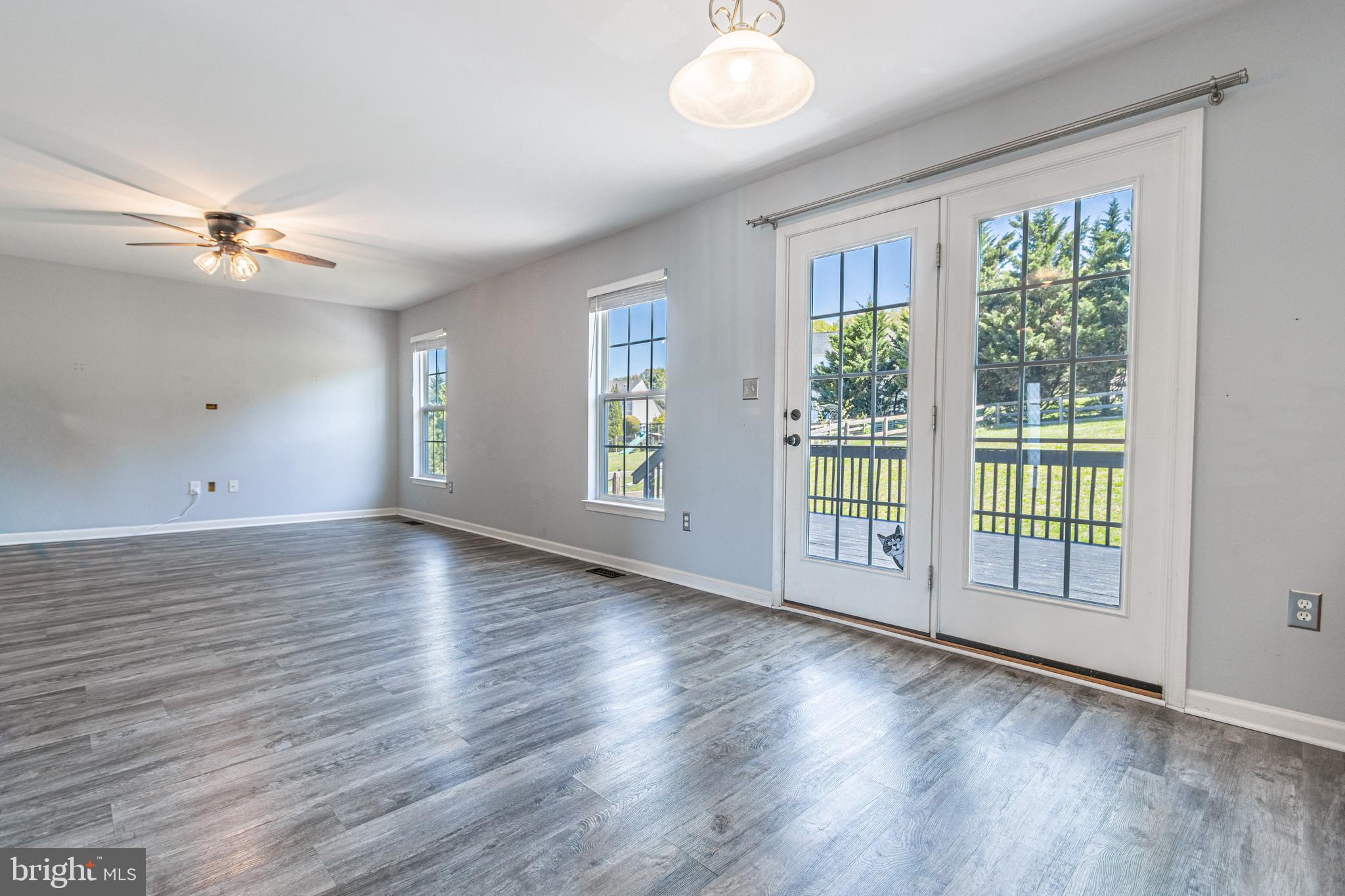 271 Courtney Court Spring Grove, PA 17362 - Photo 24 of 51 a view of an empty room with wooden floor and a window