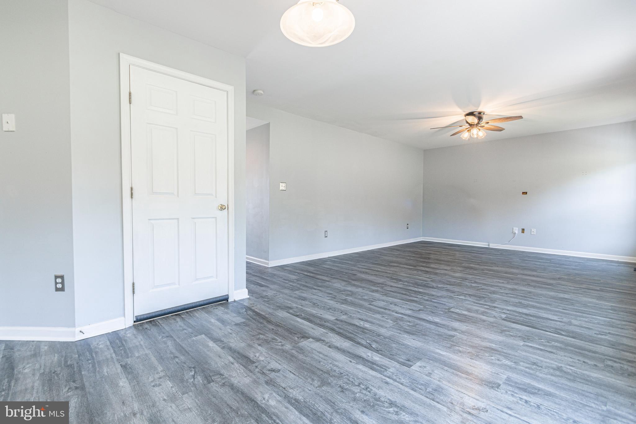 271 Courtney Court Spring Grove, PA 17362 - Photo 25 of 51 an empty room with wooden floor and fan