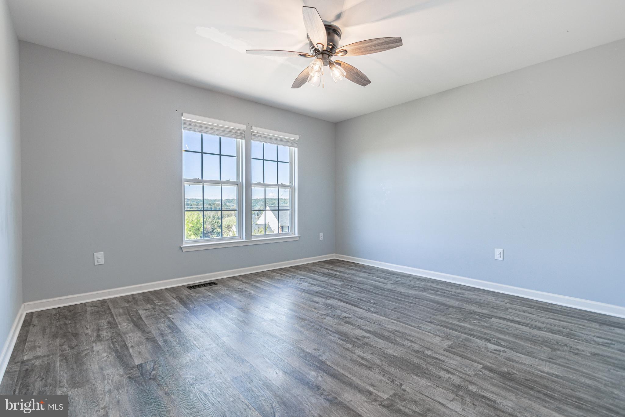 271 Courtney Court Spring Grove, PA 17362 - Photo 30 of 51 wooden floor in an empty room with a window
