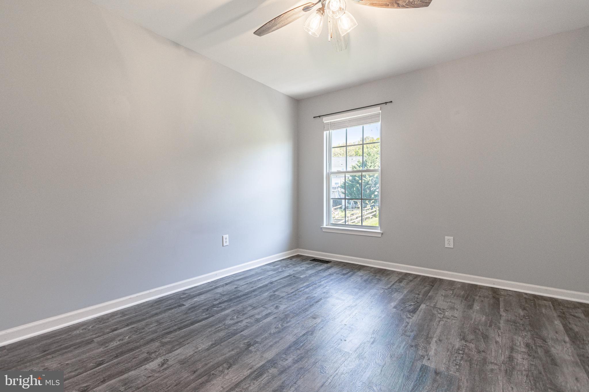 271 Courtney Court Spring Grove, PA 17362 - Photo 33 of 51 a view of an empty room with wooden floor and a window