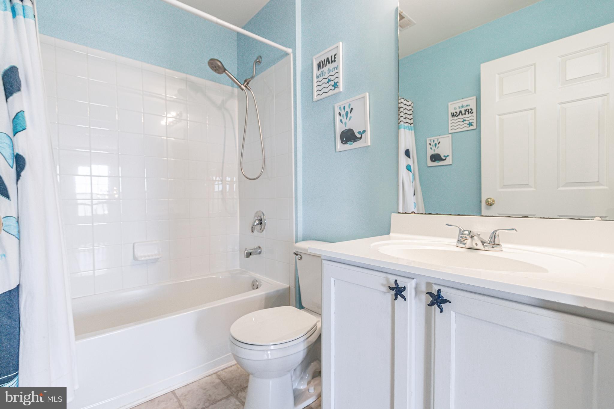 271 Courtney Court Spring Grove, PA 17362 - Photo 36 of 51 a bathroom with a sink a toilet a mirror a bathtub and shower