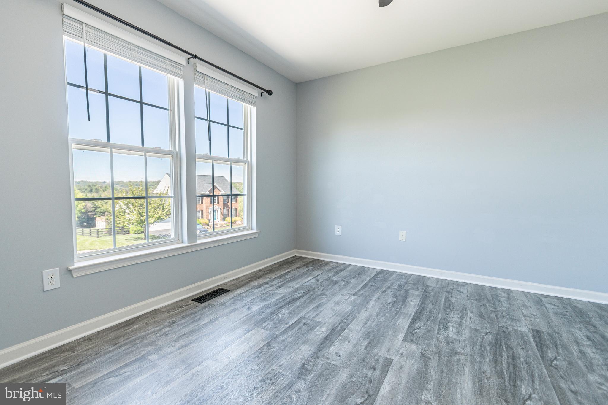 271 Courtney Court Spring Grove, PA 17362 - Photo 9 of 51 an empty room with wooden floor and windows