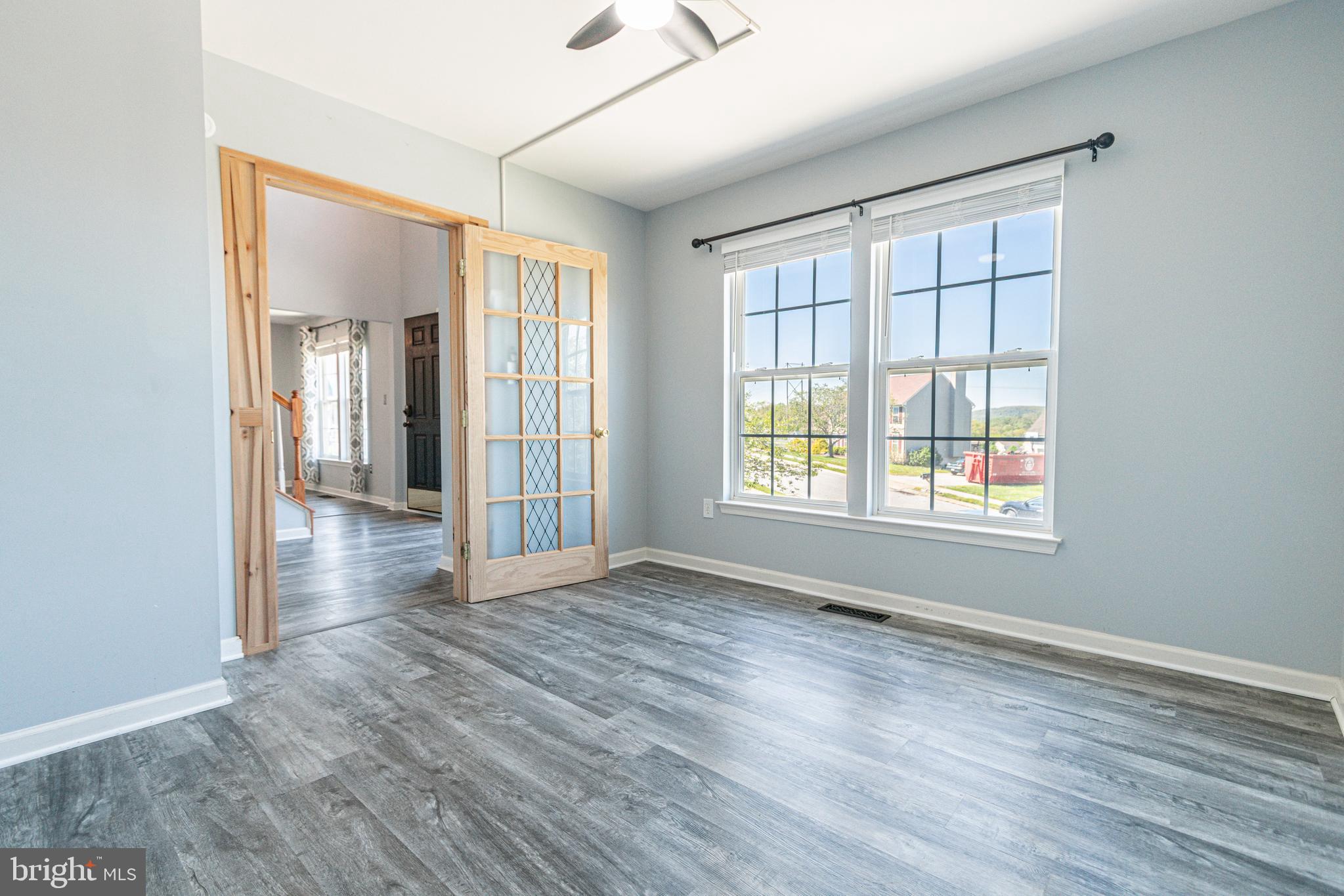 271 Courtney Court Spring Grove, PA 17362 - Photo 10 of 51 a view of an empty room with wooden floor and a window