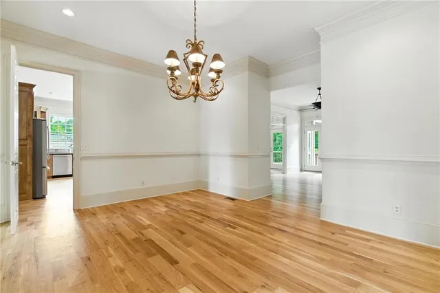 a balcony with wooden floor and fence