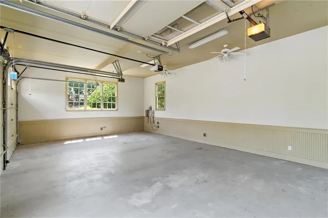 a view of an empty room with a fireplace and a window