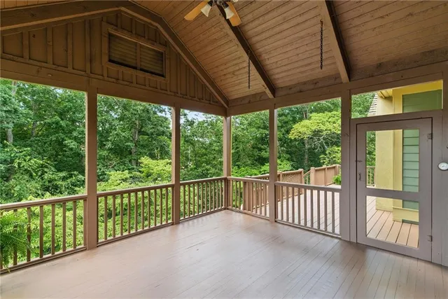 a view of an empty room with a chandelier