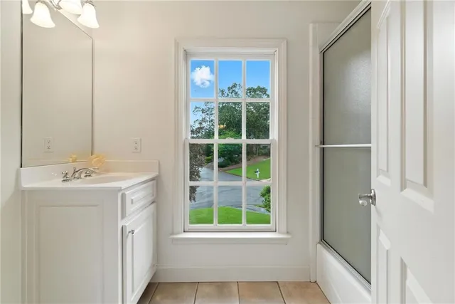 a backyard of a house with lots of green space and garden