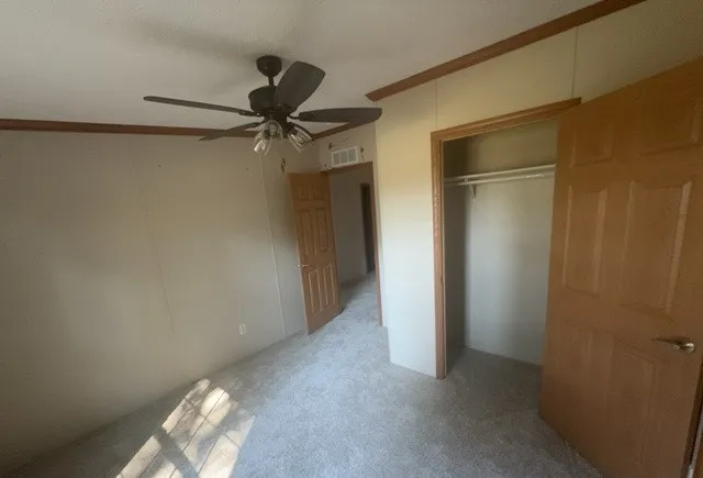 a view of a small space with a fan