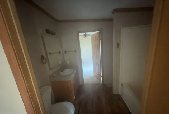 a bathroom with a shower and toilet