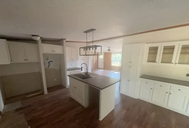a kitchen with a sink stove and refrigerator