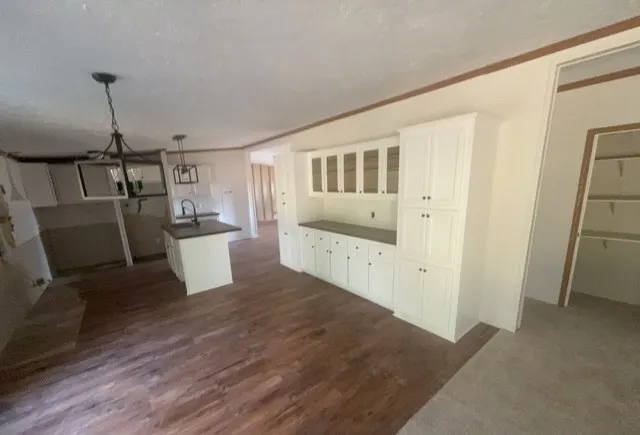 a view of a kitchen with a sink