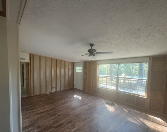 19188 East Divide Road Bluford, IL 62814 - Photo 7 of 20 an empty room with wooden floor and windows