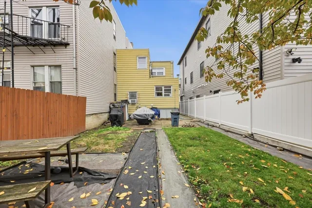 a view of a backyard with sitting area