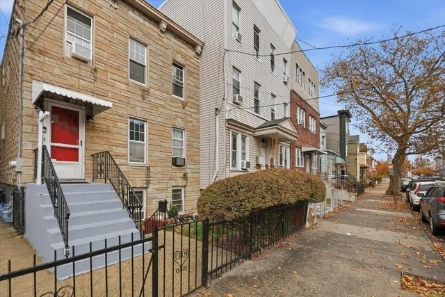 a view of a brick building with many windows