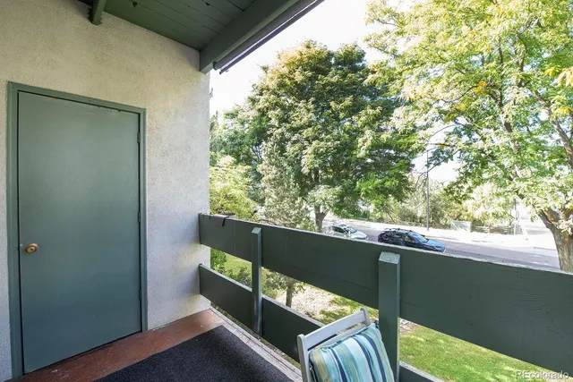 a view of balcony with furniture