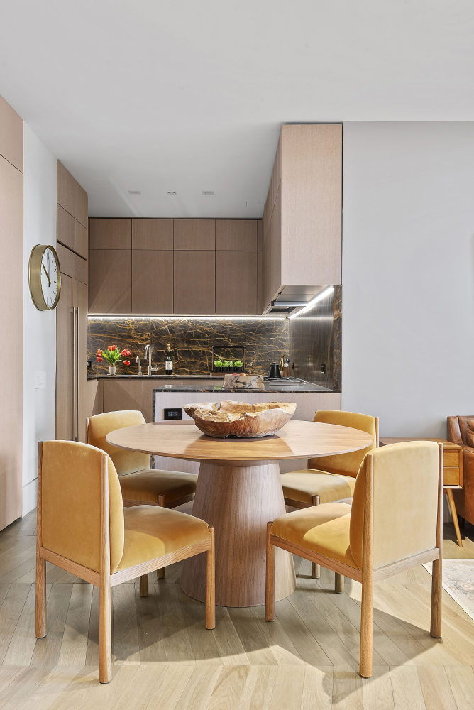 49 Chambers Street, Unit 8F Manhattan, NY 10007 - Photo 2 of 9 a dining room with a table and chairs