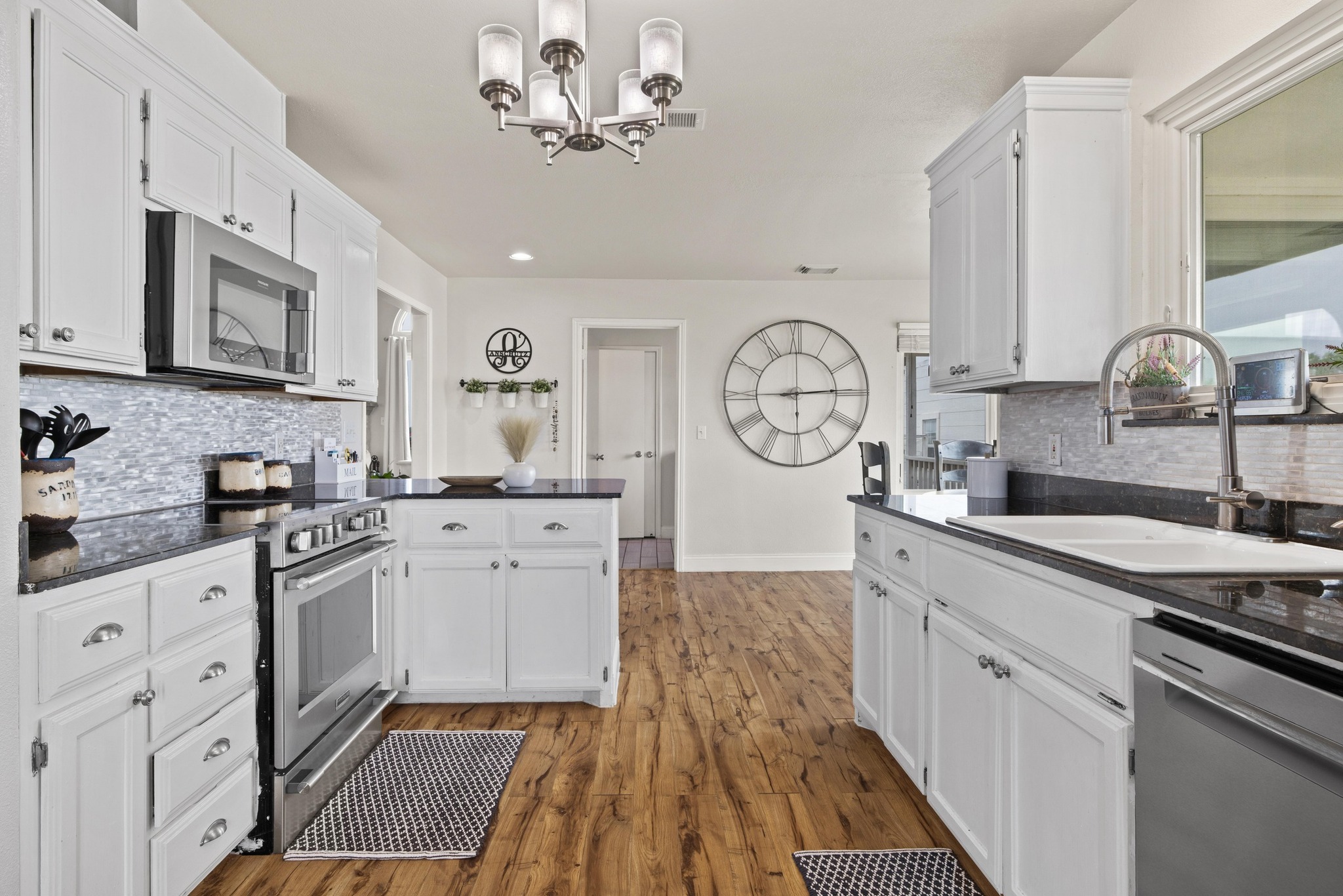 1283 Rattlesnake Trail Burnet, TX 78611 - Photo 11 of 40 a kitchen with stainless steel appliances granite countertop a sink and cabinets
