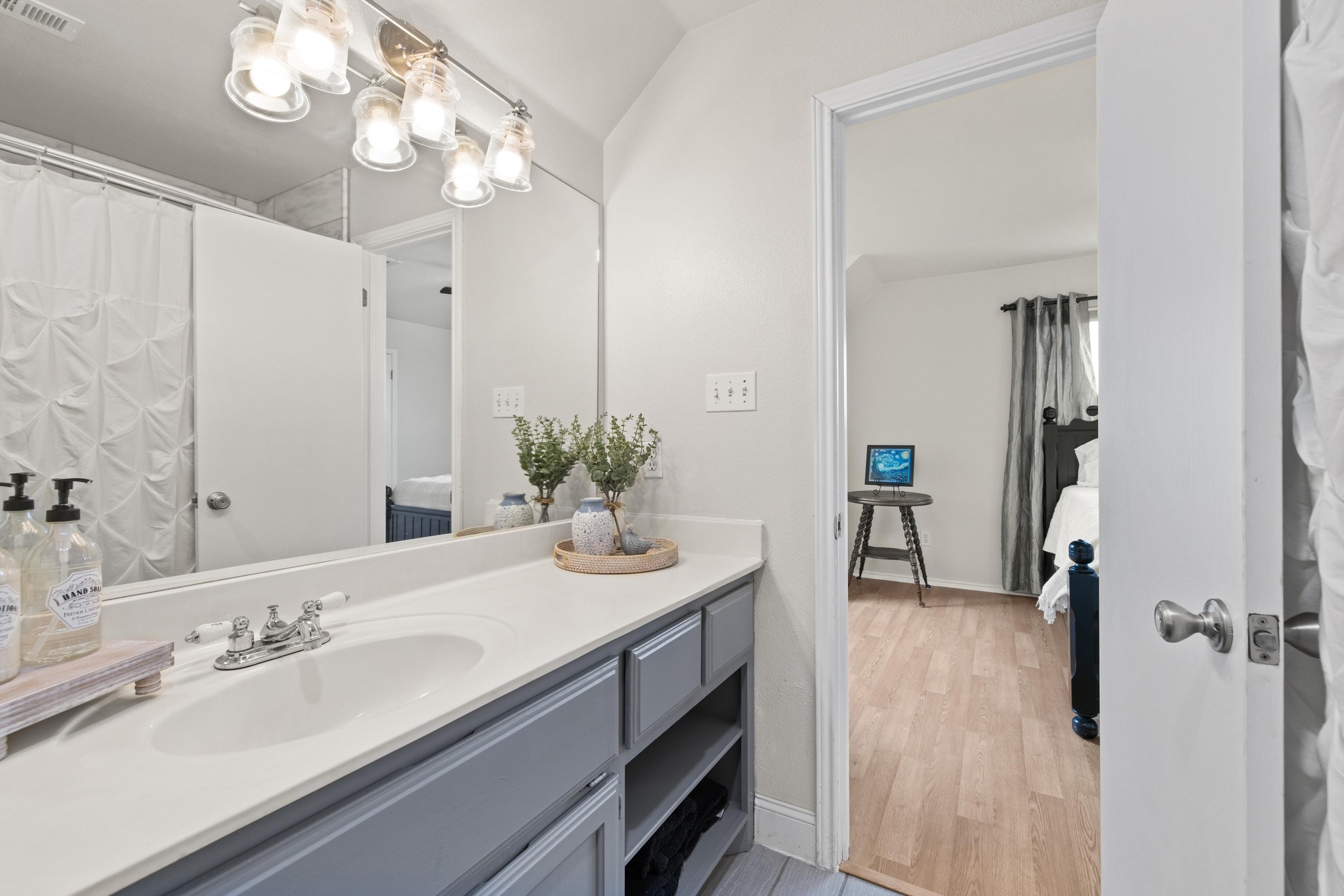 1283 Rattlesnake Trail Burnet, TX 78611 - Photo 19 of 40 a bathroom with a sink double vanity granite and a mirror