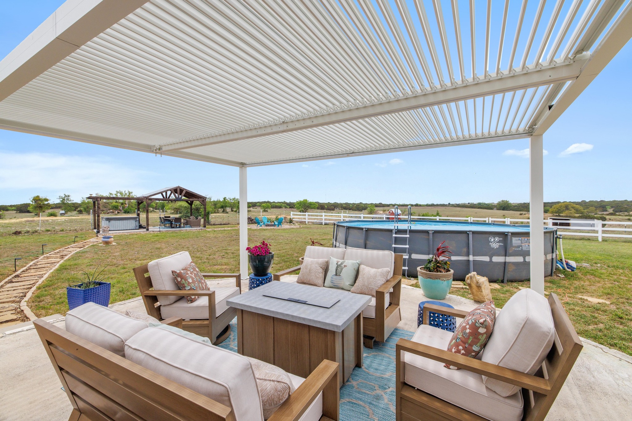 1283 Rattlesnake Trail Burnet, TX 78611 - Photo 20 of 40 a view of a patio with couches table and chairs