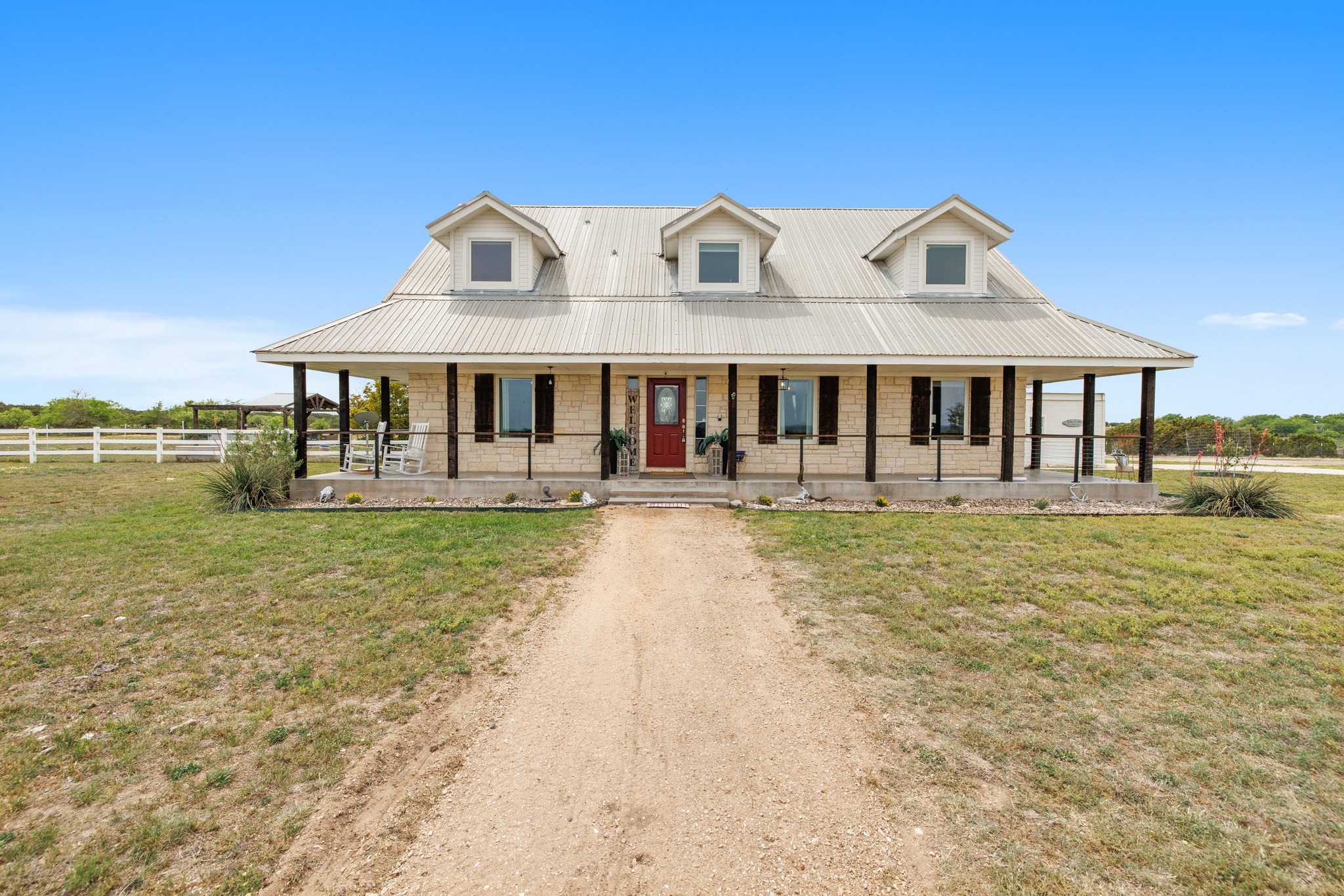 1283 Rattlesnake Trail Burnet, TX 78611 - Photo 23 of 40 a front view of a house with swimming pool having outdoor seating
