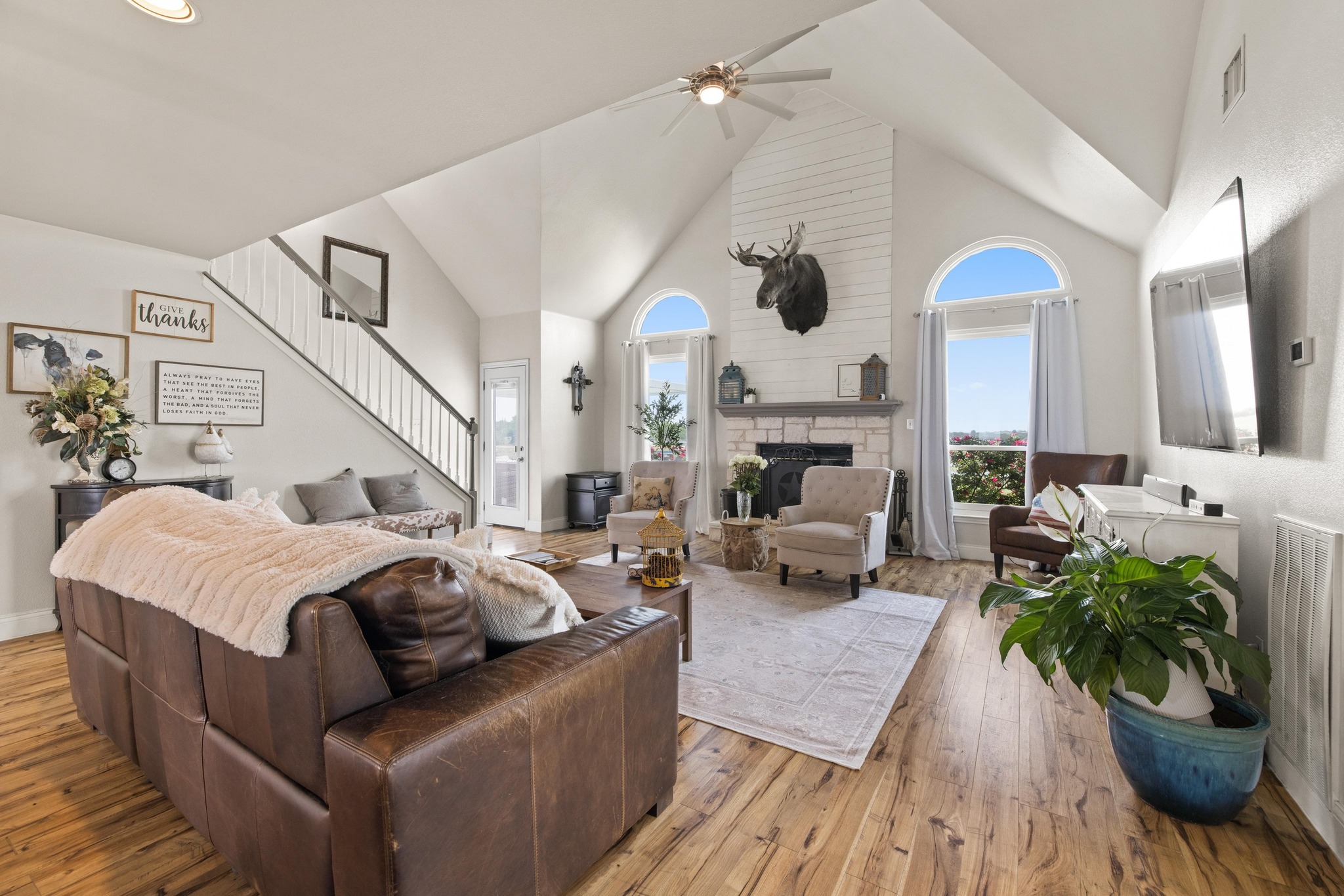 1283 Rattlesnake Trail Burnet, TX 78611 - Photo 5 of 40 a living room with furniture kitchen view and a chandelier