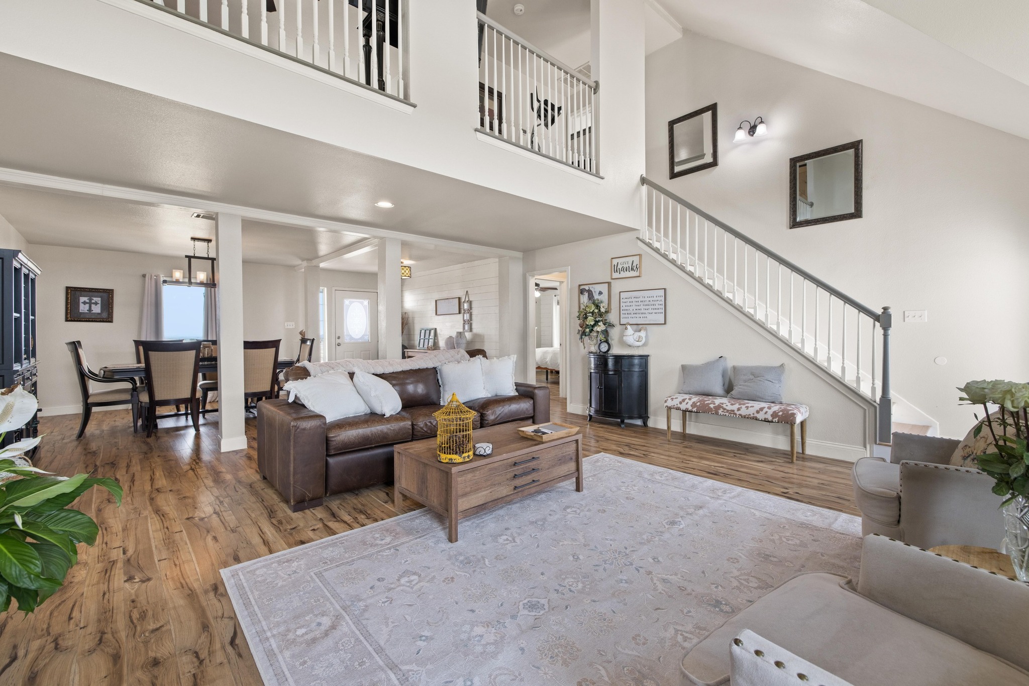 1283 Rattlesnake Trail Burnet, TX 78611 - Photo 6 of 40 a living room with furniture and a dining table with wooden floor