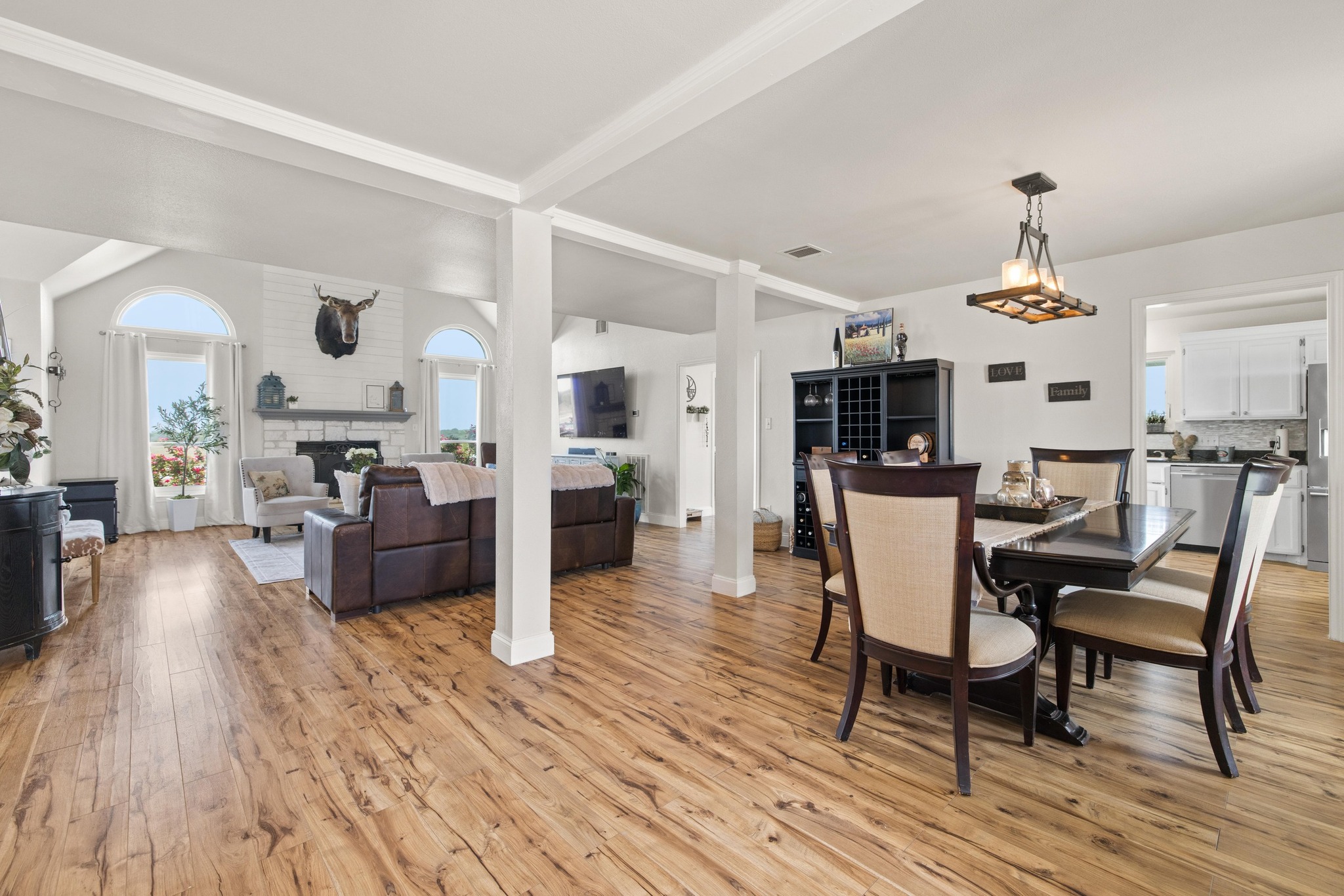 1283 Rattlesnake Trail Burnet, TX 78611 - Photo 9 of 40 a view of a dining room with furniture and wooden floor