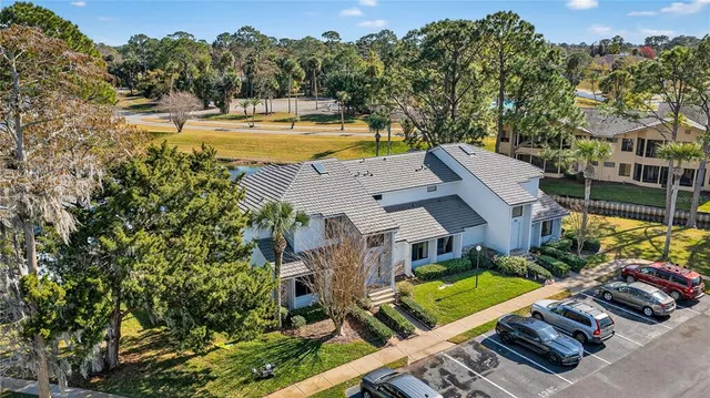 a aerial view of a house with swimming pool and patio