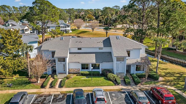 an aerial view of residential houses with outdoor space