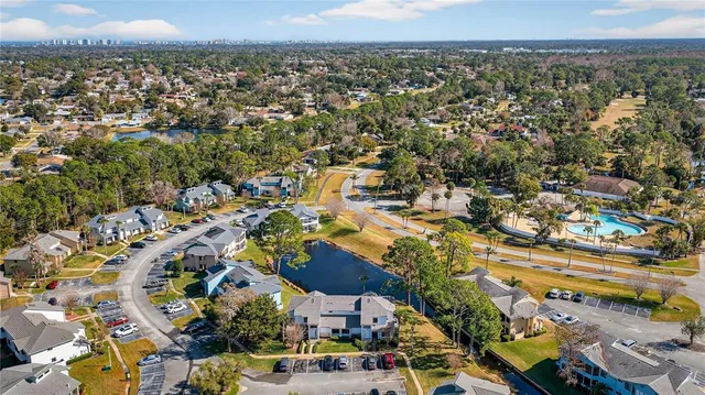 an aerial view of residential houses with outdoor space