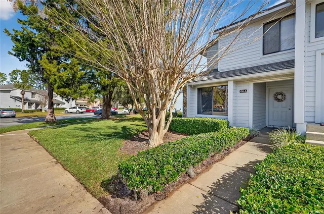 a view of a swimming pool and trees in the background