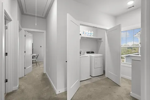 a bedroom with a bed couch and a window