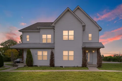 a picture of a bench in front of a wall