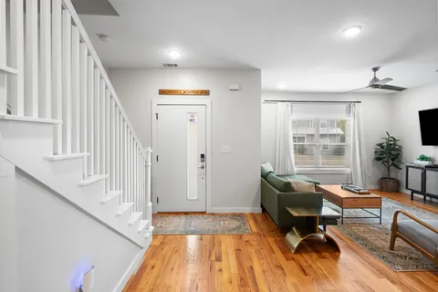 a living room with furniture and a flat screen tv