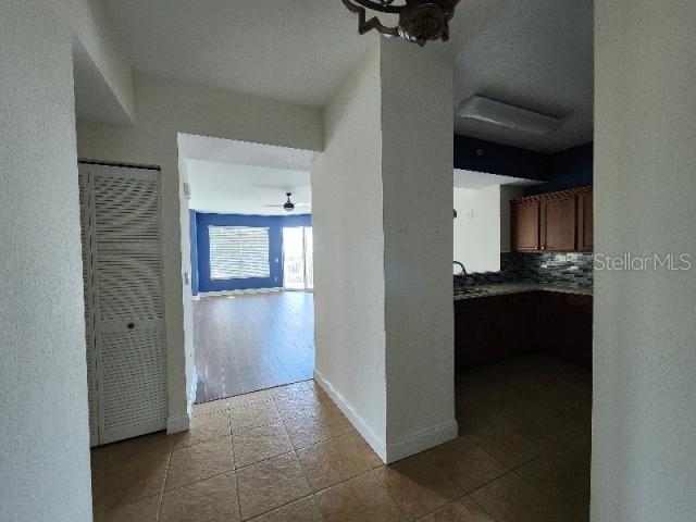 2801 South Ridgewood Avenue, Unit 403 South Daytona, FL 32119 - Photo 2 of 16 a view of a kitchen from the hallway