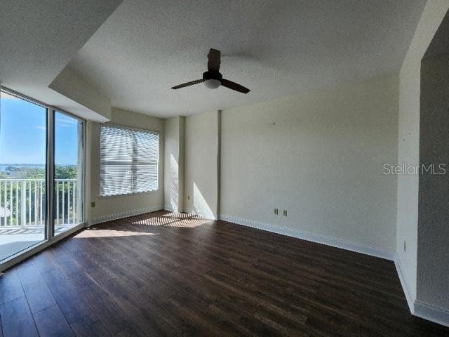 2801 South Ridgewood Avenue, Unit 403 South Daytona, FL 32119 - Photo 6 of 16 a view of an empty room with wooden floor and a window