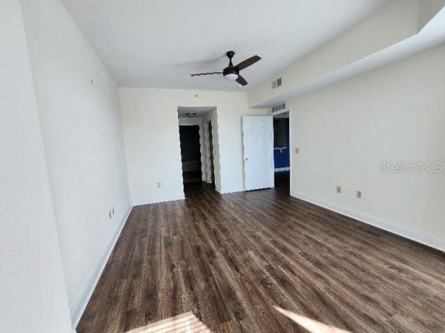 2801 South Ridgewood Avenue, Unit 403 South Daytona, FL 32119 - Photo 7 of 16 a view of a livingroom with wooden floor and ceiling fan