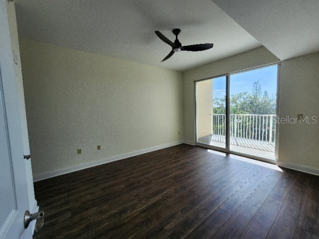 2801 South Ridgewood Avenue, Unit 403 South Daytona, FL 32119 - Photo 9 of 16 a view of a room with wooden floor and windows