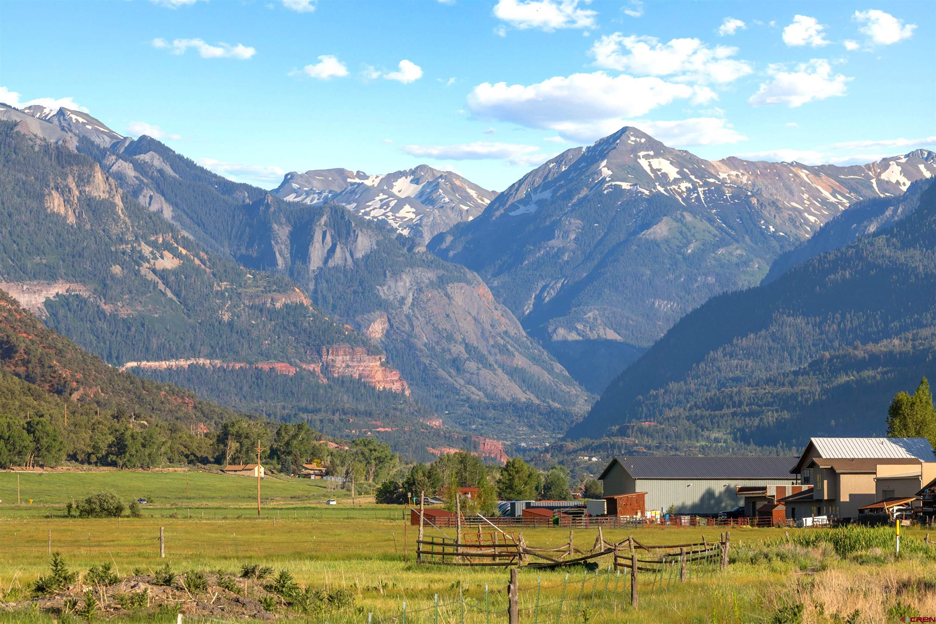 a view of a building with mountains in the background