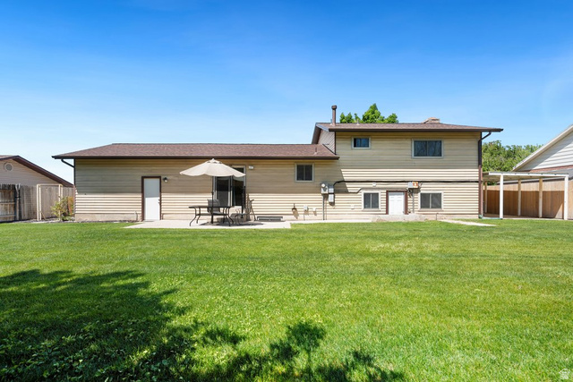 865 South 325 West Orem, UT 84058 - Photo 34 of 38 Expansive green lawn with a concrete patio