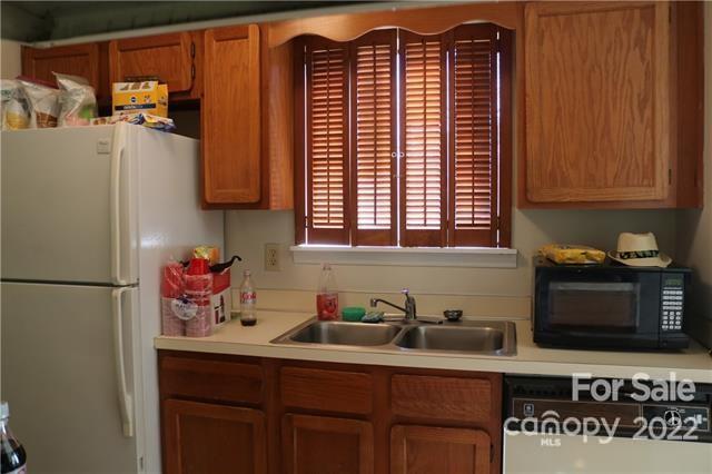 11007 Running Ridge Road Charlotte, NC 28226 - Photo 17 of 38 a kitchen with stainless steel appliances a sink cabinets and a window