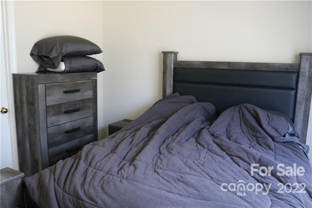 11007 Running Ridge Road Charlotte, NC 28226 - Photo 23 of 38 a bed sitting in a bedroom next to a window