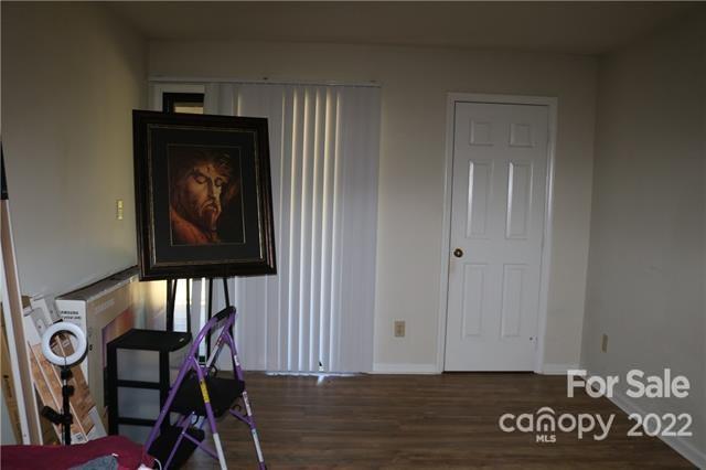 11007 Running Ridge Road Charlotte, NC 28226 - Photo 29 of 38 a view of a hallway with wooden floor and a table