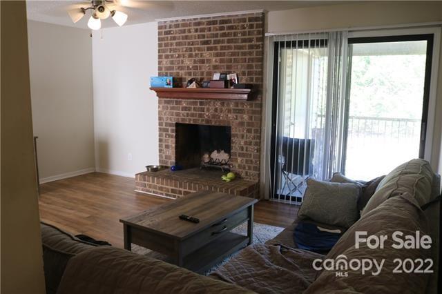 11007 Running Ridge Road Charlotte, NC 28226 - Photo 3 of 38 a living room with furniture and a fireplace